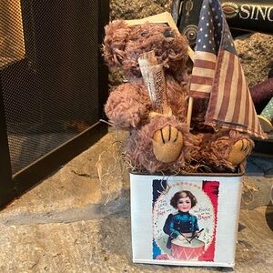 Teddy Roosevelt bear sitting in a metal tin w/ American flag & declaration
